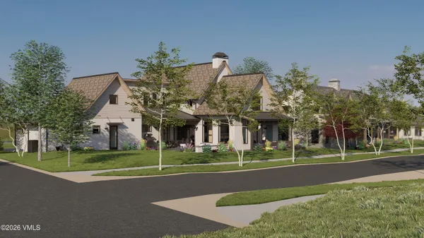 front view of a house with a tree