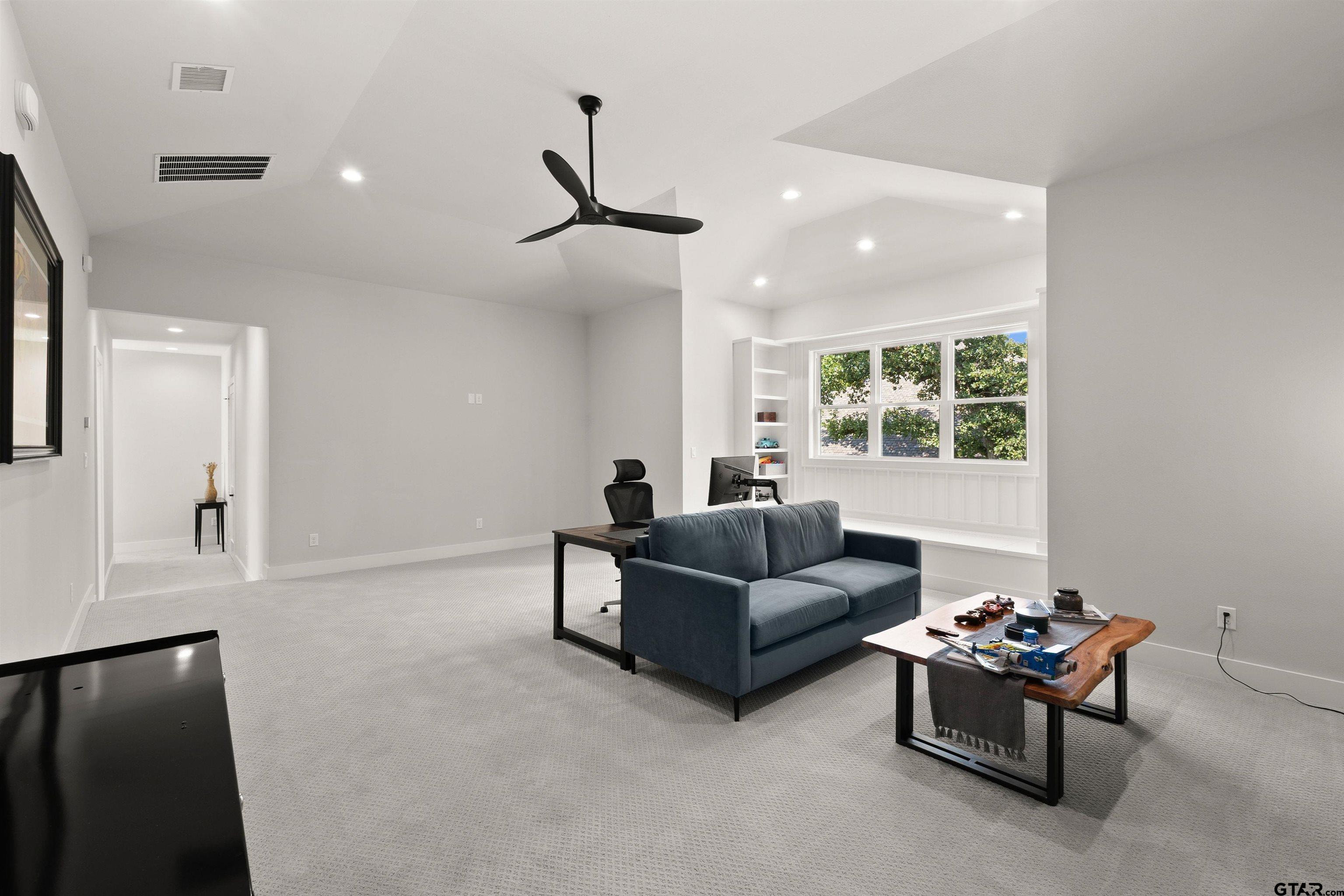 2895 Stewart Way Tyler, TX 75709 - Photo 11 of 44 a living room with furniture and a window