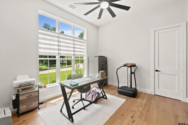 a spacious bedroom with a large bed and a window