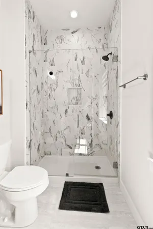 a view of a house with a backyard and a tree