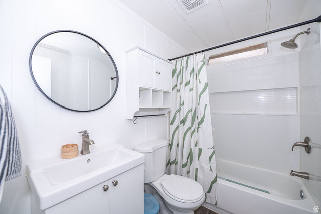 2600 North Hill Field Road, Unit 5 Layton, UT 84041 - Photo 21 of 33 Bathroom featuring a white vanity with integrated sink, brushed nickel faucet, and circular black-framed mirror