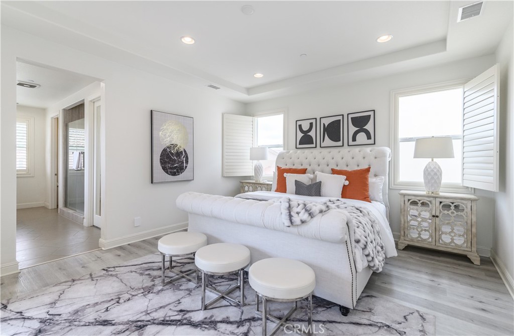 33 Swift Lake Forest, CA 92630 - Photo 18 of 56 a bedroom with a bed and dresser with mirror