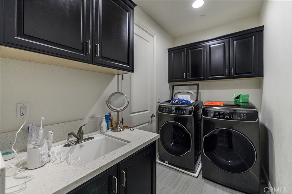 33 Swift Lake Forest, CA 92630 - Photo 26 of 56 a kitchen with a sink a stove and cabinets
