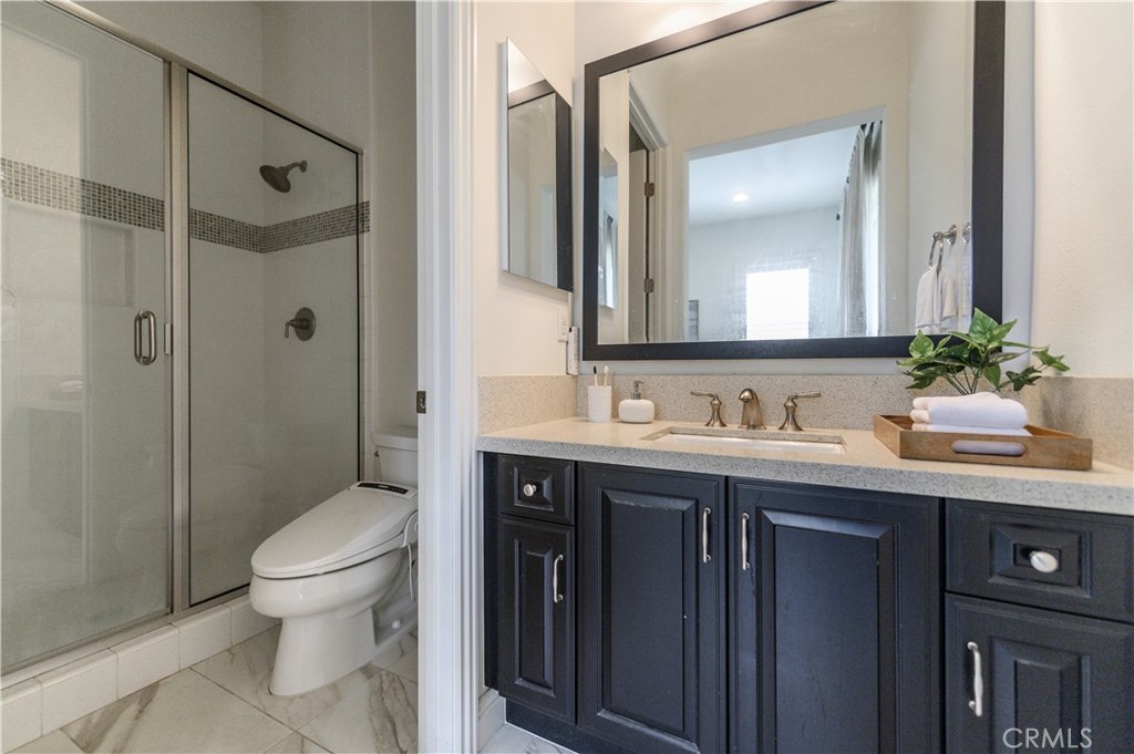 33 Swift Lake Forest, CA 92630 - Photo 32 of 56 a bathroom with a granite countertop sink toilet and shower