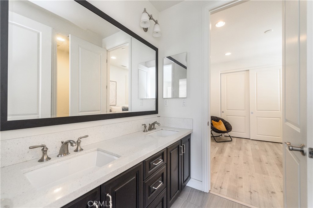 33 Swift Lake Forest, CA 92630 - Photo 33 of 56 a bathroom with a double vanity sink a and mirror
