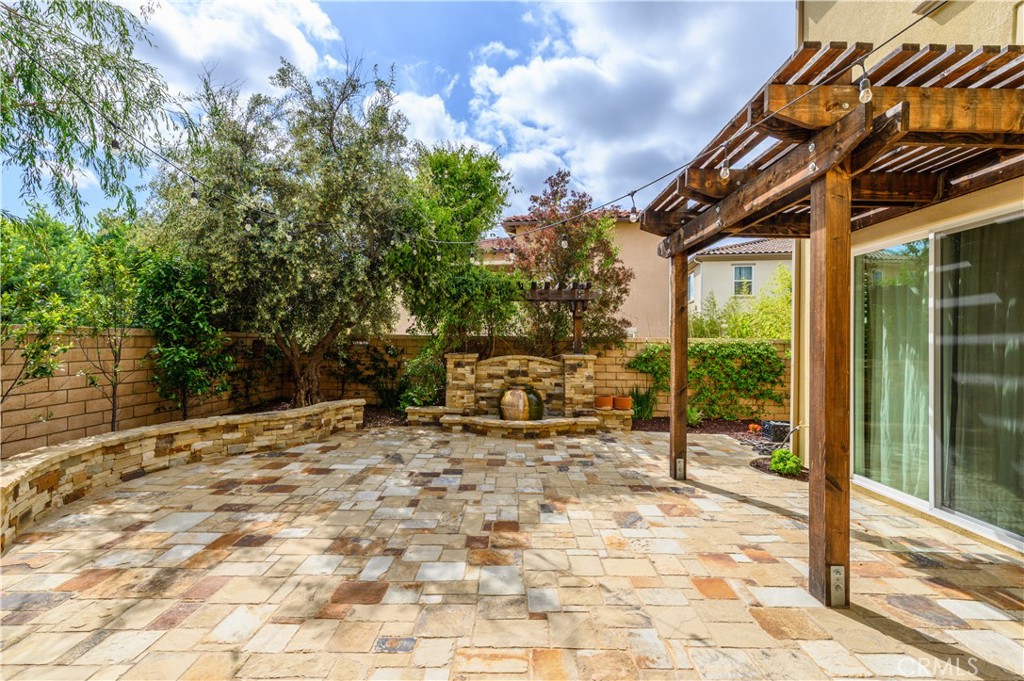 33 Swift Lake Forest, CA 92630 - Photo 36 of 56 a backyard of a house with table and chairs