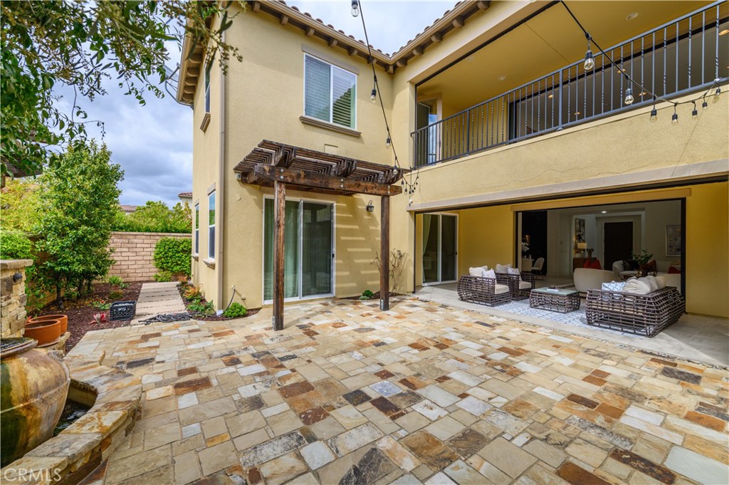 33 Swift Lake Forest, CA 92630 - Photo 38 of 56 a view of a house with backyard sitting area and porch