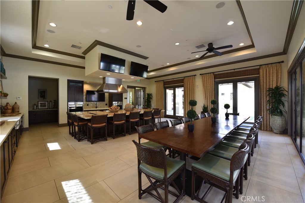 33 Swift Lake Forest, CA 92630 - Photo 47 of 56 a living room with furniture a chandelier and a flat screen tv