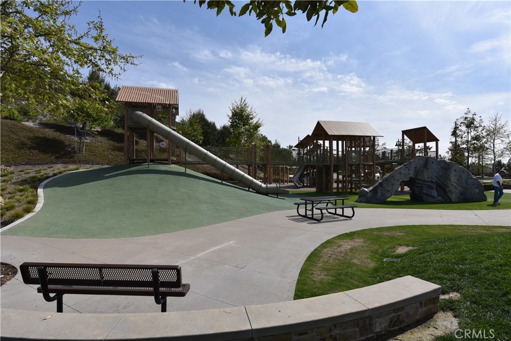 33 Swift Lake Forest, CA 92630 - Photo 55 of 56 a view of a swimming pool with lawn chairs and plants