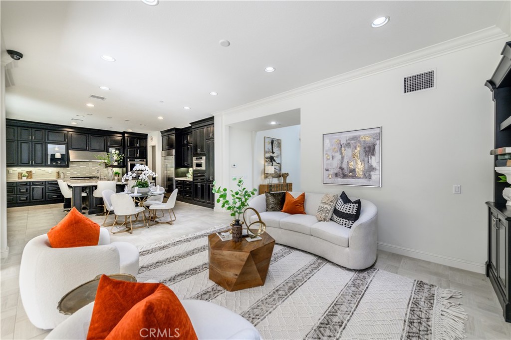33 Swift Lake Forest, CA 92630 - Photo 8 of 56 a living room with furniture a rug and a view of kitchen