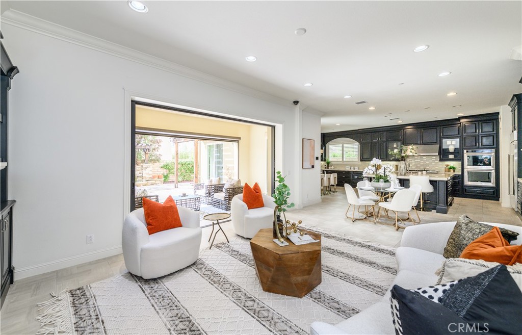 33 Swift Lake Forest, CA 92630 - Photo 9 of 56 a living room with furniture a table and a potted plant