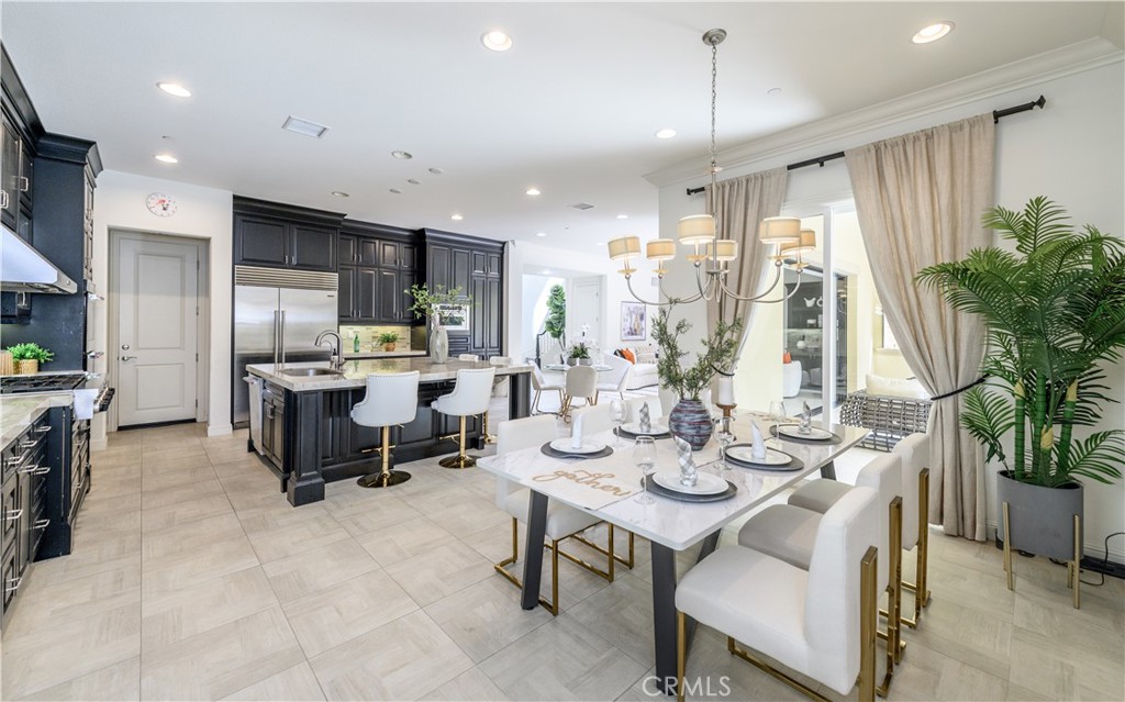 33 Swift Lake Forest, CA 92630 - Photo 10 of 56 a kitchen with sink refrigerator dining table and chairs