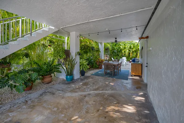 a view of a patio with plants and garden