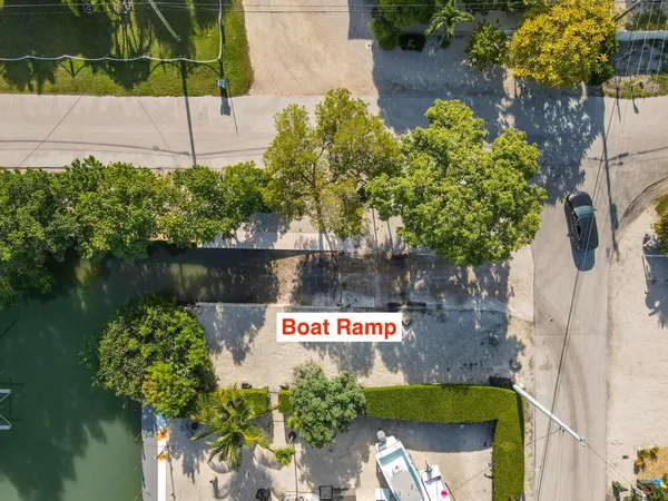 a bathroom with a toilet a sink and a mirror