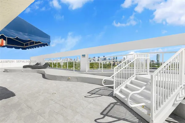 a view of pool with outdoor seating and a patio