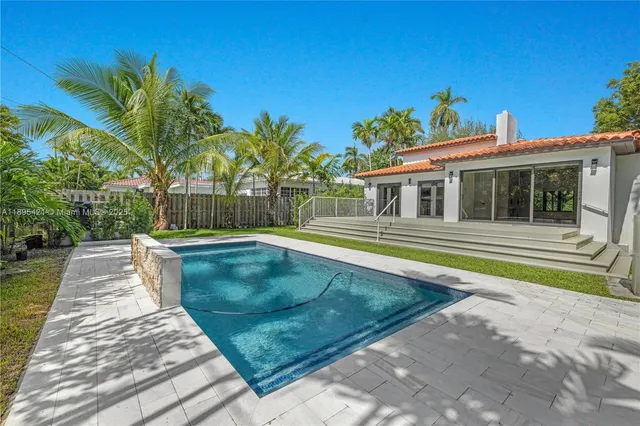 a view of a house with swimming pool