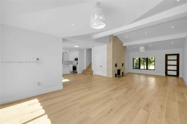 a view of an empty room and window