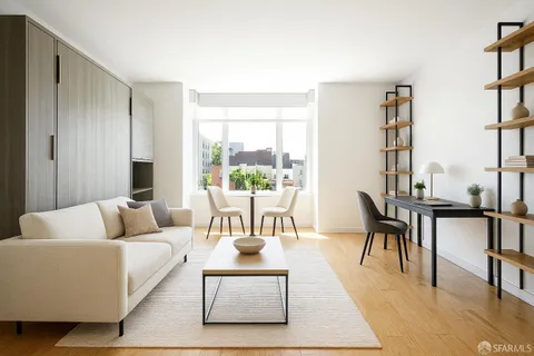 a living room with furniture wooden floor and a rug