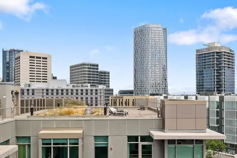 a view of city with tall buildings