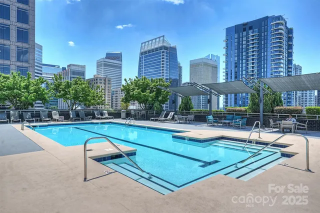 a view of a swimming pool with chairs