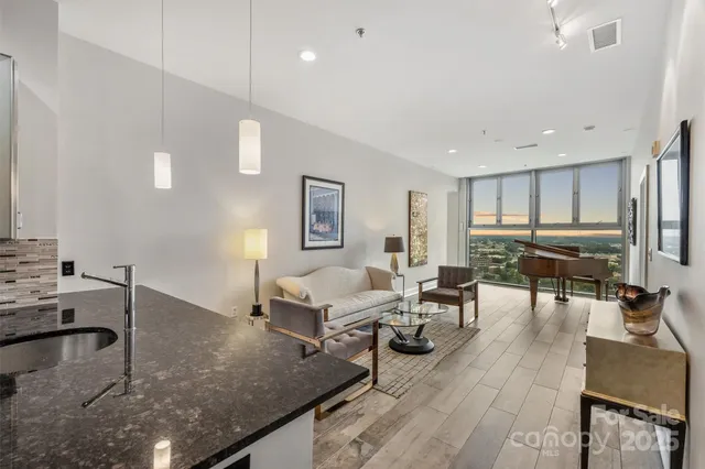 a living room with furniture and a table