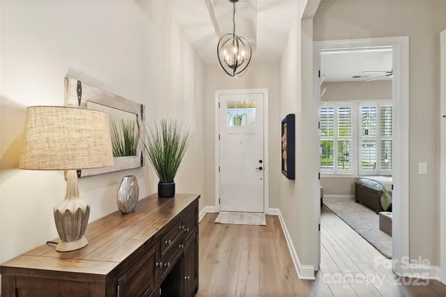 a view of living room with furniture and wooden floor