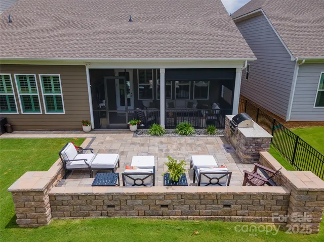 a view of house with outdoor seating area