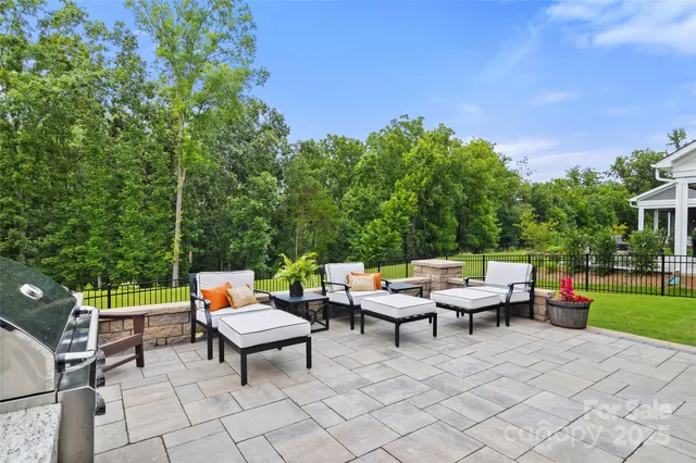 a backyard of a house with outdoor seating
