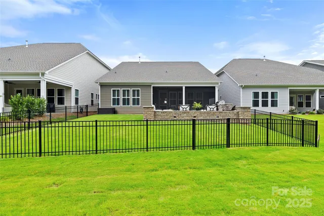 a view of house with a yard