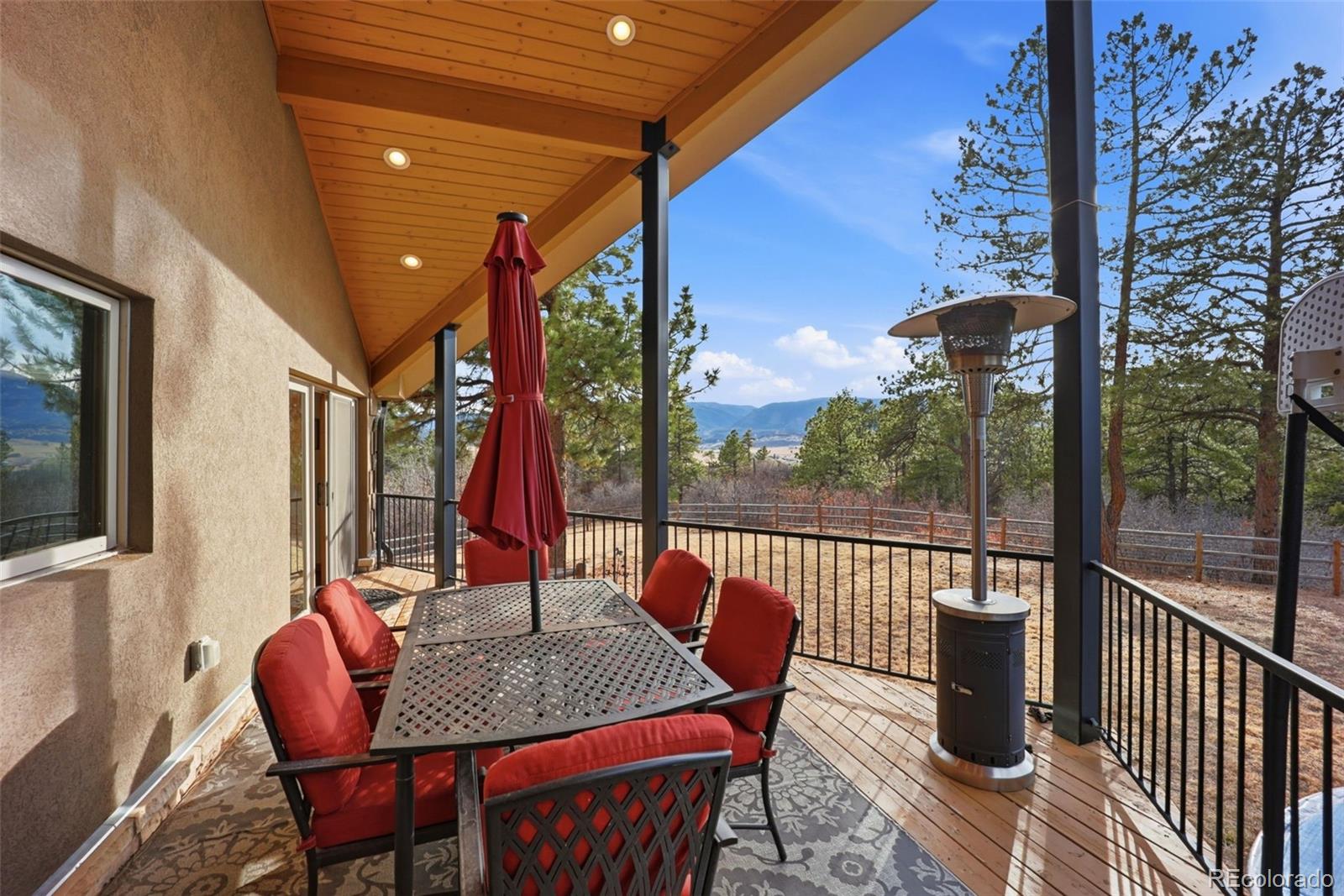 5000 South Perry Park Road Sedalia, CO 80135 - Photo 14 of 50 a outdoor space with the couches and dining table with chairs