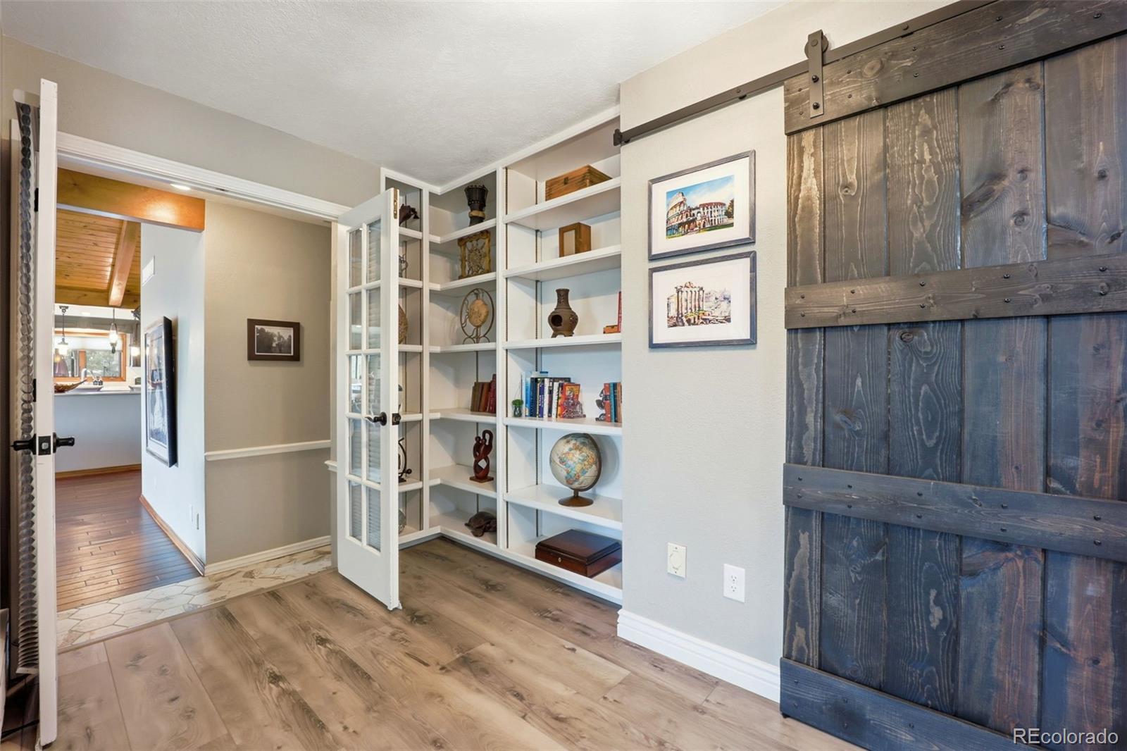 5000 South Perry Park Road Sedalia, CO 80135 - Photo 21 of 50 a view of an entryway with wooden floor