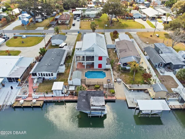 an aerial view of a house with a ocean view