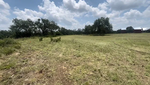 a view of a lake with a big yard