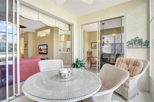 a living room with furniture and a breakfast area