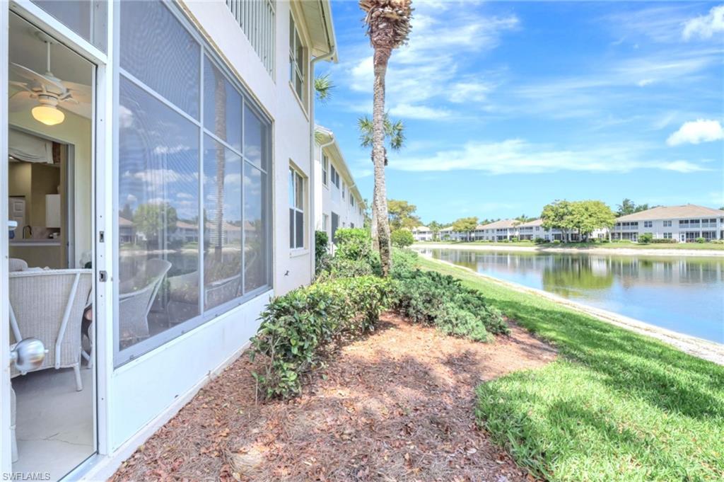 784 Carrick Bend Circle, Unit 101 Naples, FL 34110 - Photo 25 of 34 a view of a garden with a patio