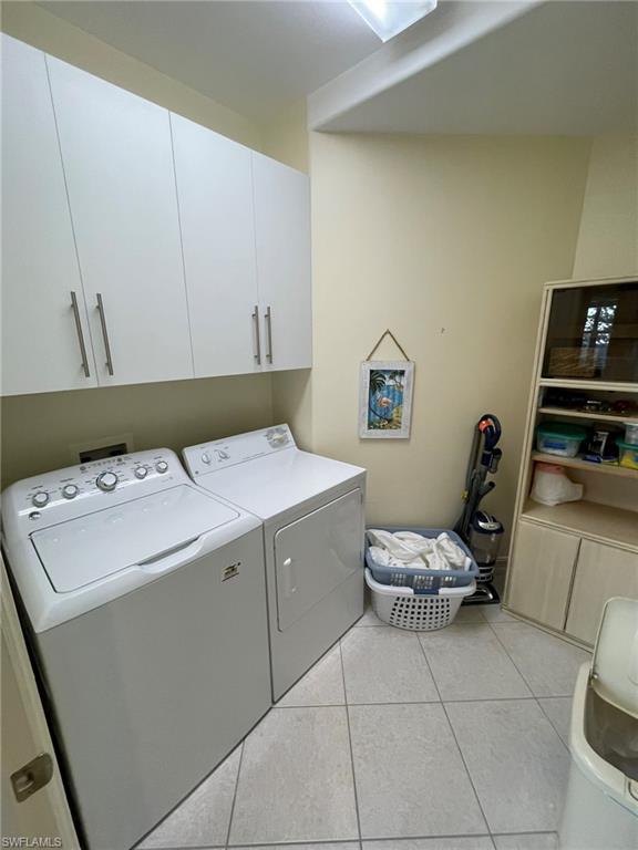 784 Carrick Bend Circle, Unit 101 Naples, FL 34110 - Photo 34 of 34 a utility room with dryer and washer
