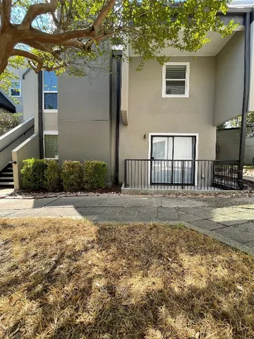 a view of a backyard of the house