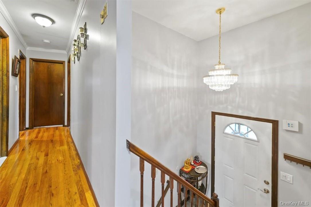24 Marc Terrace Monroe, NY 10950 - Photo 18 of 28 a view of a hallway with a chandelier