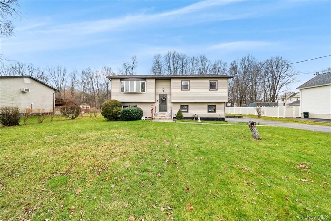 24 Marc Terrace Monroe, NY 10950 - Photo 23 of 28 a view of a house with a big yard and large trees