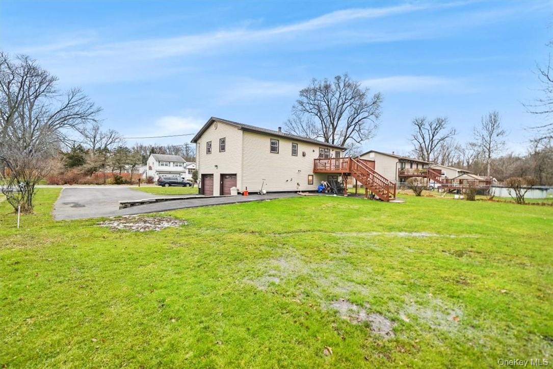 24 Marc Terrace Monroe, NY 10950 - Photo 25 of 28 a view of a house with a big yard and large trees