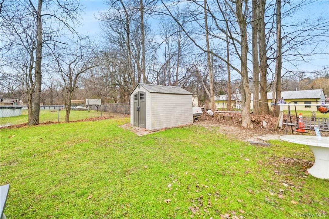 24 Marc Terrace Monroe, NY 10950 - Photo 26 of 28 a view of a yard with a house and a large tree