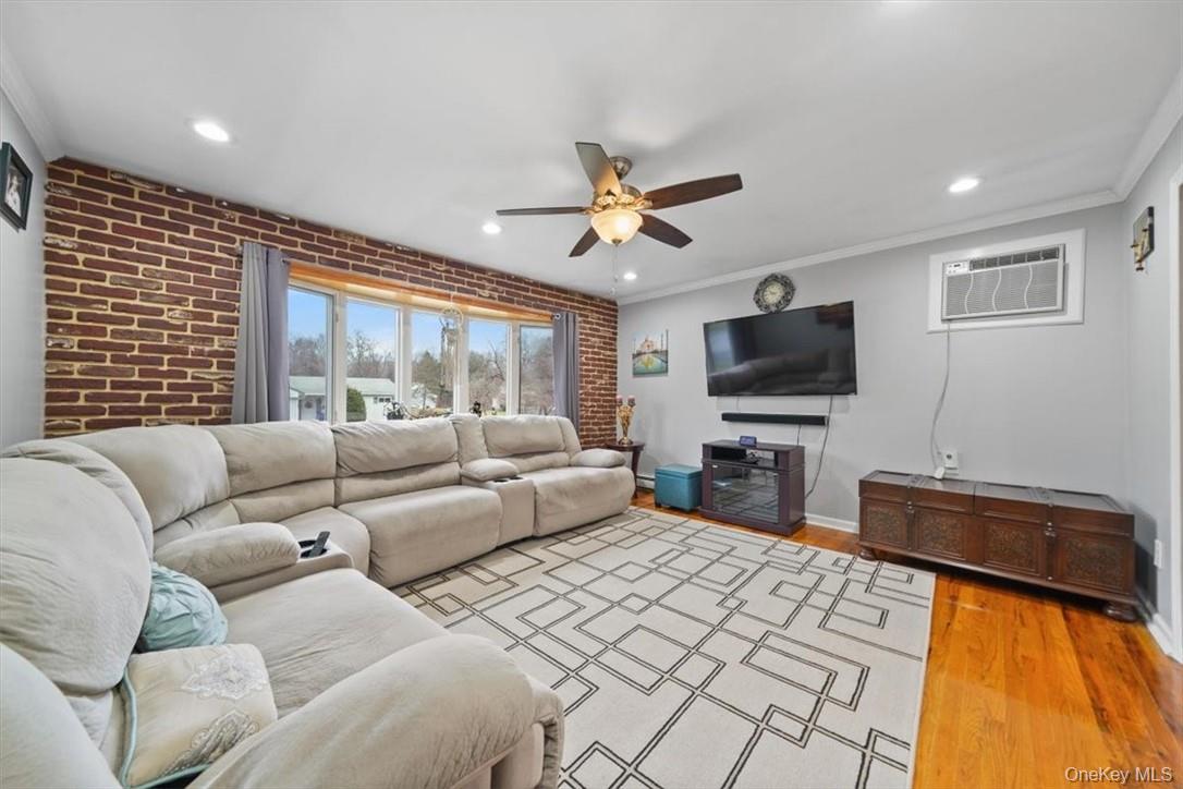 24 Marc Terrace Monroe, NY 10950 - Photo 7 of 28 a living room with furniture and a flat screen tv