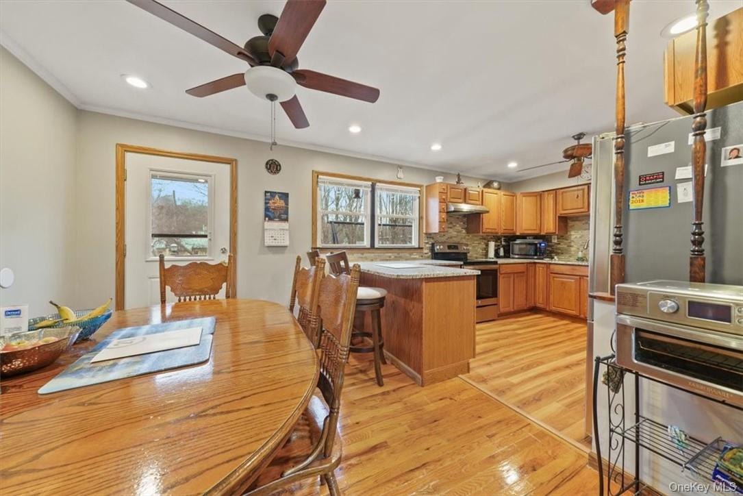 24 Marc Terrace Monroe, NY 10950 - Photo 8 of 28 a living room with stainless steel appliances kitchen island granite countertop furniture and a view of kitchen