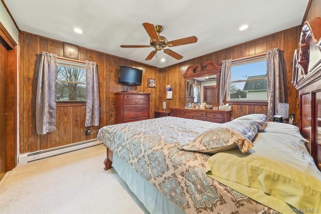 24 Marc Terrace Monroe, NY 10950 - Photo 10 of 28 a bed sitting in a spacious bedroom next to a window
