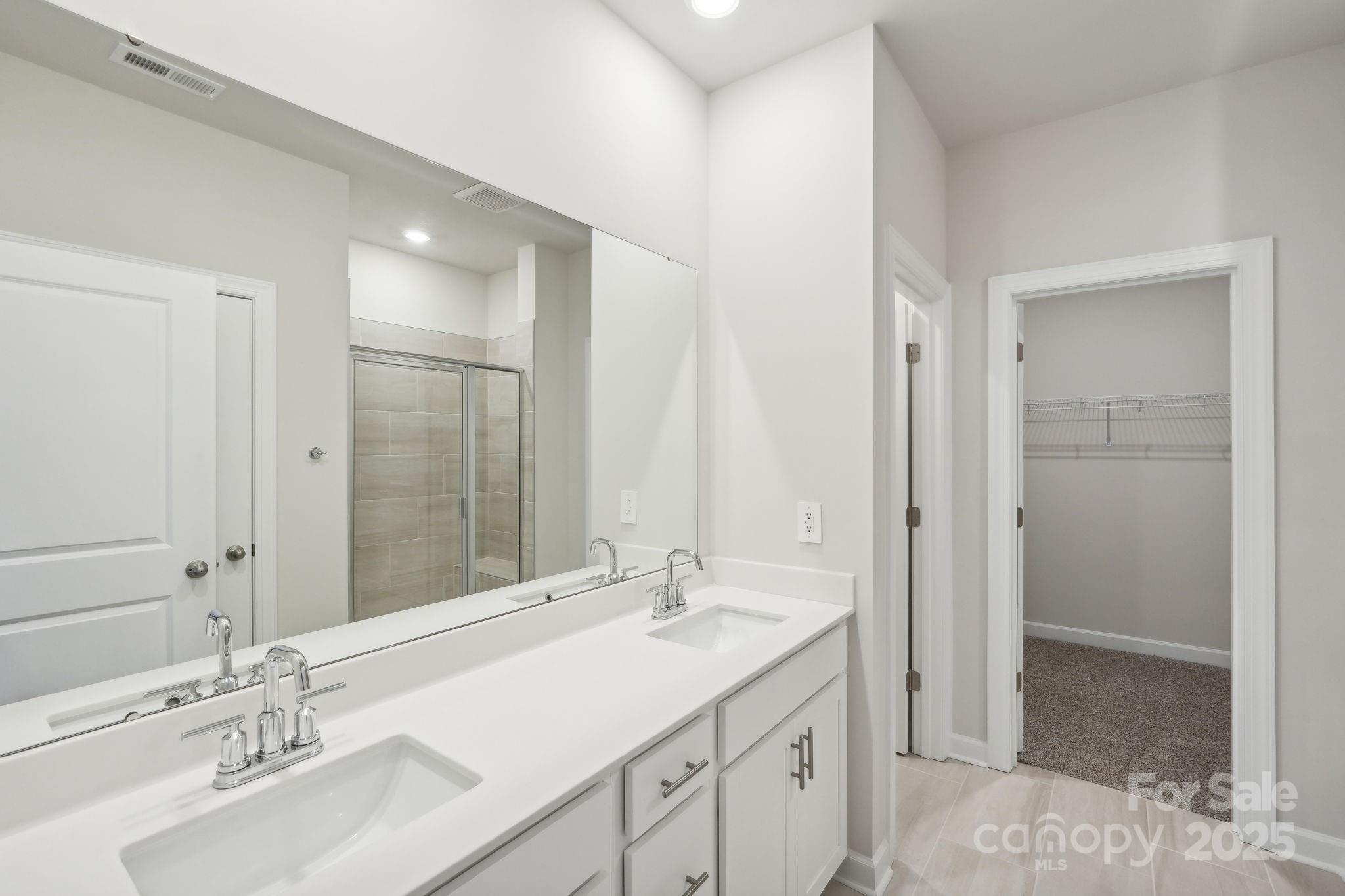195 Murphy Mdw Road Mocksville, NC 27028 - Photo 4 of 12 a bathroom with a sink double vanity and a mirror