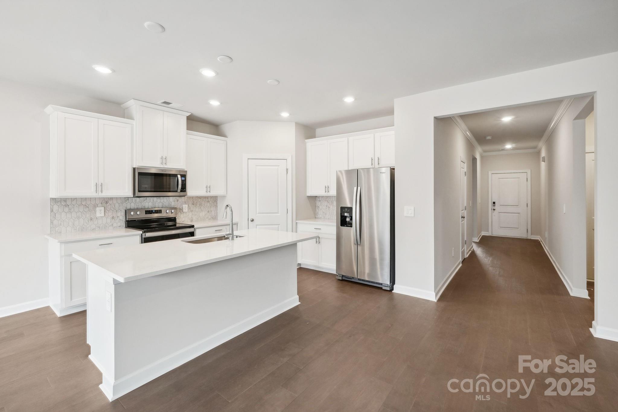 195 Murphy Mdw Road Mocksville, NC 27028 - Photo 6 of 12 a kitchen with stainless steel appliances a refrigerator stove top oven and sink