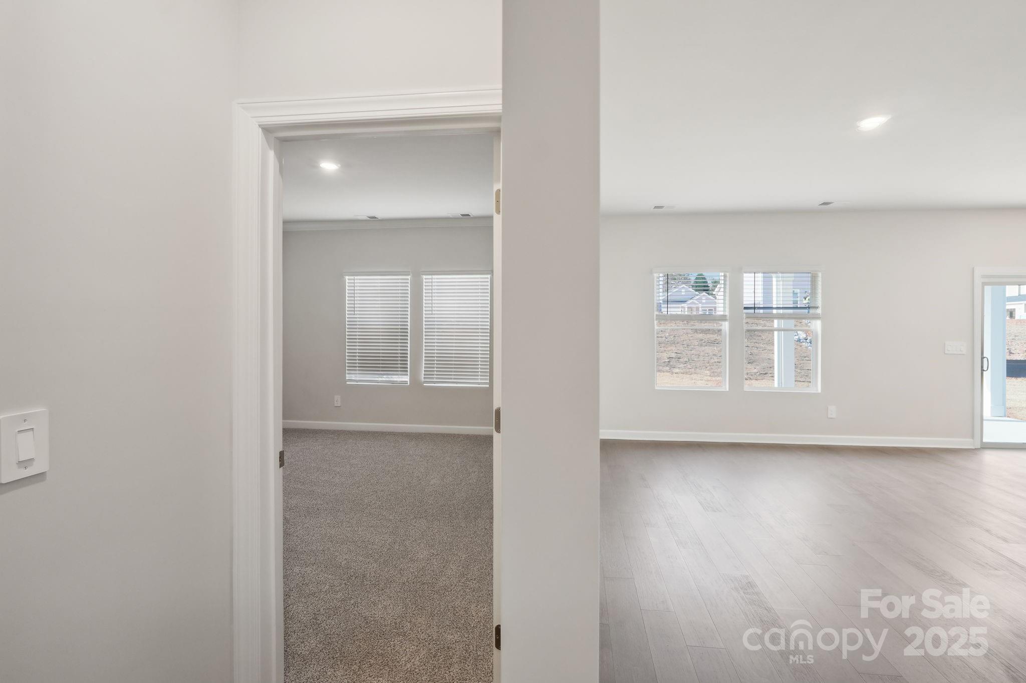 195 Murphy Mdw Road Mocksville, NC 27028 - Photo 8 of 12 an empty room with wooden floor and a window