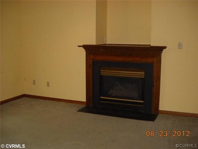 3908 Paces Ferry Road Chester, VA 23831 - Photo 4 of 6 a living room with a fireplace