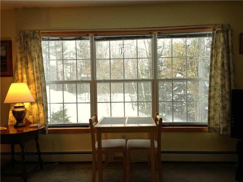 27 Wires Hill Road Durham, ME 04222 - Photo 11 of 35 Living Room. A bank of windows over...