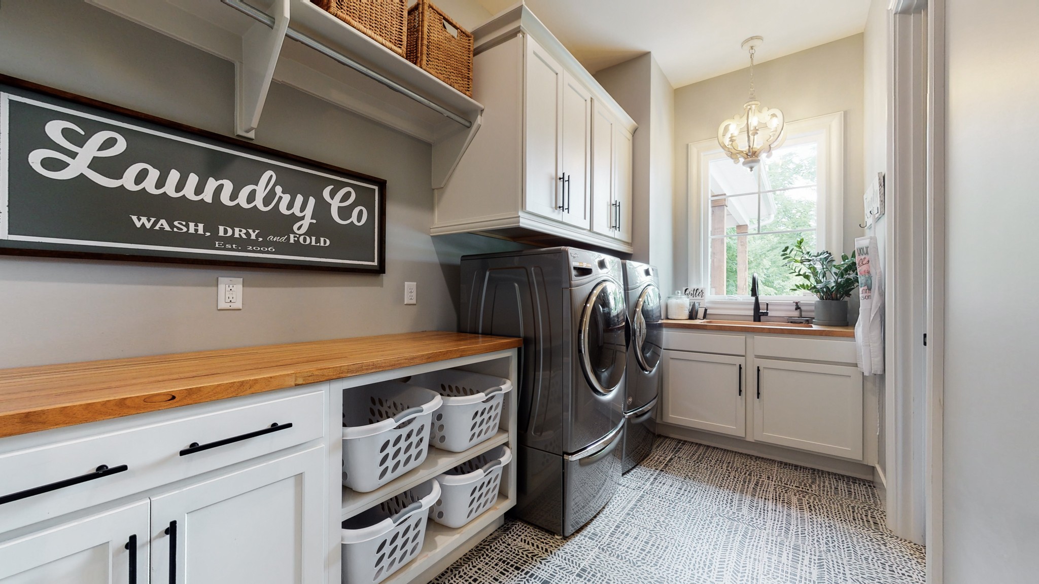5530 Baker Road Murfreesboro, TN 37129 - Photo 23 of 49 If you are the Launderer for your family, you will enjoy this space more than you should. Sink is at the end, beneath the window, & the cabinets above will hold all the necessary supplies. How about the long folding counter atop MORE cabinets?